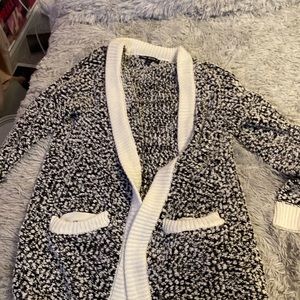 A black and white knit cardigan.
